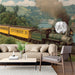 Classic steam train mural installed on a large wall in a cozy library with dark wood bookshelves
