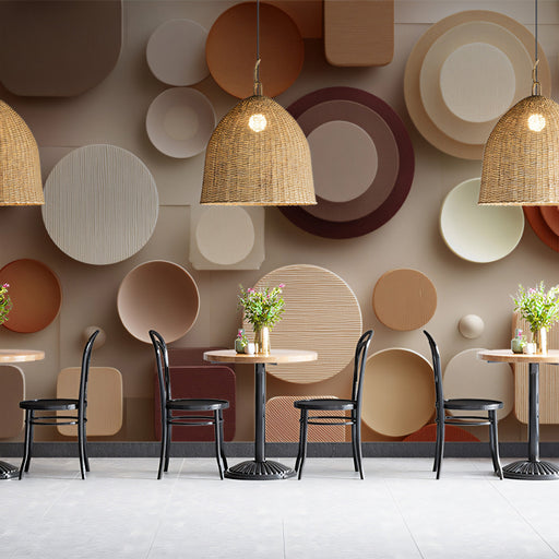 Geometric earth-tone wallpaper installed in a modern living room with neutral furniture.