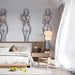 Sophisticated boutique hallway wall decorated with repeating elegant figure sketches in monochrome