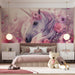 A creative playroom space decorated with a soft unicorn and flower wall pattern for an imaginative environment