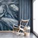 A serene bedroom retreat with the blue and white fluid motion mural behind a minimalist bed frame.