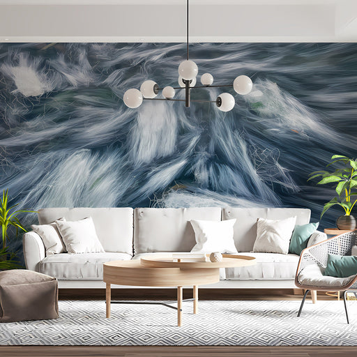 A modern living room featuring the flowing white and slate abstract mural behind a gray velvet sofa.
