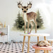 A whimsical playroom interior featuring a wall mural of a small fawn for a playful and nature-inspired look.