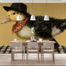 A colorful and creative playroom featuring the dapper duckling mural with bright toys and furniture.