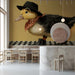 A cheerful nursery room featuring a wall with the dapper duckling mural and soft wooden furniture.