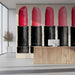 A stylish dressing room with this lipstick mural on the main wall behind a modern vanity mirror.