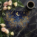An elegant bedroom setting with the midnight gold and blue botanical mural behind a velvet headboard.