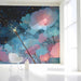 Floral mural installed on a large bedroom feature wall behind a velvet bed frame