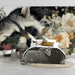 A serene bedroom setting with a nature-inspired raccoon wallpaper as a gentle accent wall