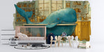 Whimsical whale mural installed in a playful children's bathroom with simple white fixtures.