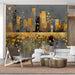 Modern living room featuring a golden city skyline mural as a focal point above a gray velvet sofa.