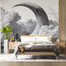 A cozy reading nook featuring the surreal moon and architecture mural above a velvet armchair.