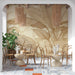 A light and airy dining room wall featuring neutral tropical leaf wallpaper design.