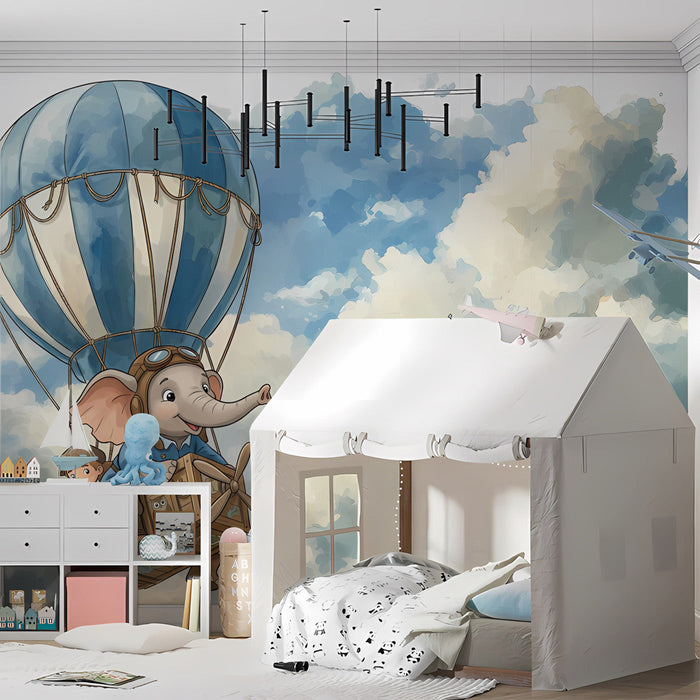 A child’s bedroom with the whimsical elephant balloon mural behind a small reading chair.