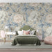 Floral mural wallpaper installed in a sophisticated living room with neutral decor.