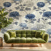Sophisticated bedroom interior featuring a blue and cream floral wall mural behind a headboard