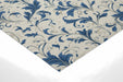 Sophisticated home office with elegant blue acanthus wall mural and brass desk lamp