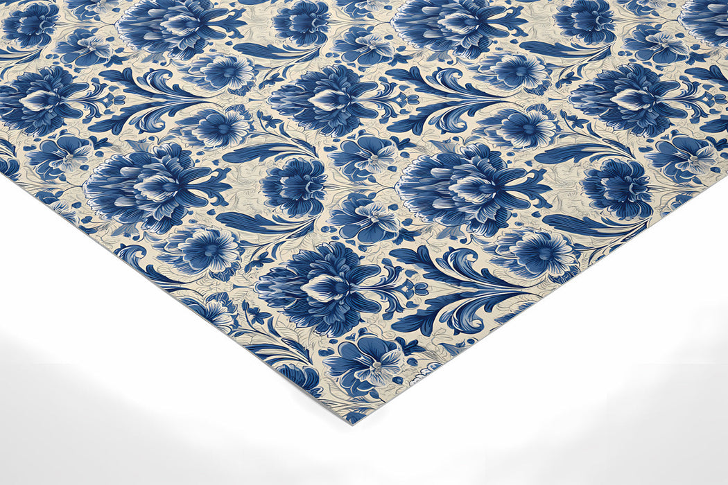 An elegant entryway hallway decorated with indigo floral damask wallpaper and white crown molding.