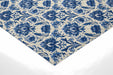 An elegant entryway hallway decorated with indigo floral damask wallpaper and white crown molding.