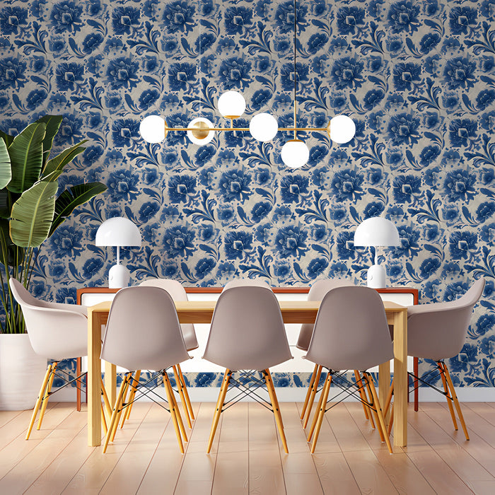 A cozy library reading nook featuring vintage-style blue and cream floral wallpaper.
