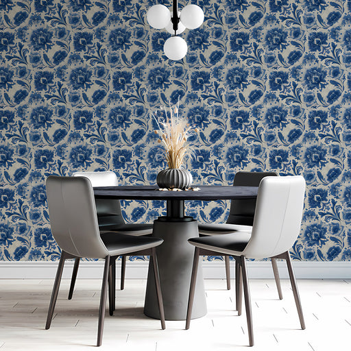 A sophisticated dining room with blue floral damask wallpaper and a long wooden table.