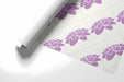 Minimalist lavender flower mural behind a white desk in a home office