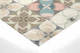 A cozy nursery interior showing the gentle pastel mosaic pattern on a feature wall.
