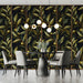 Sophisticated bedroom interior with an olive branch mural behind a neutral headboard