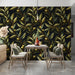 Moody olive branch wallpaper installed as a feature wall in a sophisticated dining room