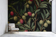 Modern living room featuring a dark botanical olive branch wallpaper as a sophisticated statement wall