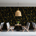 Gilded olive branch mural installed in a moody dining room with brass accents