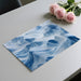 Modern home office with a fluid blue and white mountain landscape mural on the main feature wall.