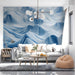 Contemporary bedroom showcasing a calm abstract blue and white landscape mural above a bed.