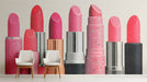 A chic dressing room interior featuring the lipstick mural as a vibrant, stylish focal point