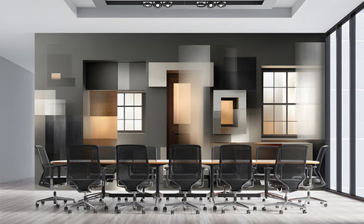 Modern office space with charcoal and amber geometric mural creating a professional backdrop