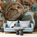 Whimsical cat wallpaper installed in a cozy nursery with light wood furniture
