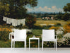 Countryside landscape mural installed in a bright, rustic dining room with wooden furniture