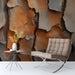 Living room featuring natural pine bark mural wallpaper behind a tan leather sofa