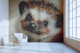 Whimsical hedgehog mural installed in a nursery with light wood furniture