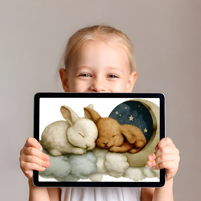 A cozy reading nook for children with the sleeping bunny wallpaper on the main wall behind a plush armchair.