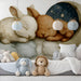 A nursery wall featuring the bunny and moon mural above a white wooden crib and neutral bedding.