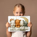 Whimsical bunny mural design used as a charming feature wall in a cozy kid's bedroom.