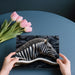 A stylish home office with the monochromatic zebra relief mural on a focal wall