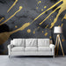 Modern living room featuring a dramatic black and gold abstract mural behind a velvet sofa