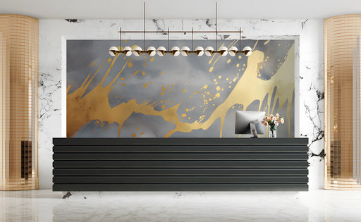 Modern living room featuring a gold drip mural behind a charcoal gray velvet sofa and minimalist coffee table.
