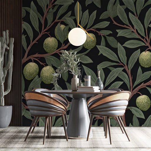 A cozy reading nook featuring an olive branch botanical mural on the feature wall behind a velvet armchair.
