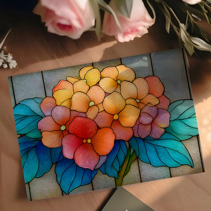 Stained glass floral wallpaper used as a bold accent in a sun-drenched creative home office.