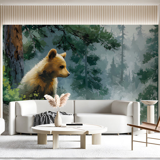 A cozy nursery featuring a woodland mural with a bear cub on the main wall
