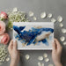 An elegant home office with a dark wooden desk and the whale mural providing a sophisticated, creative atmosphere