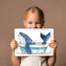Playful whale wallpaper design featuring in a clean contemporary bathroom